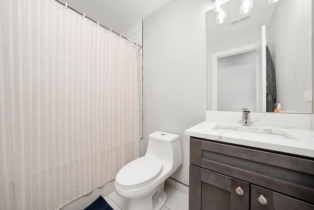 7230 W Belden Ave Unit 1, Elmwood Park, IL 60707 - bathroom featuring vanity, toilet, tile patterned floors, and curtained shower