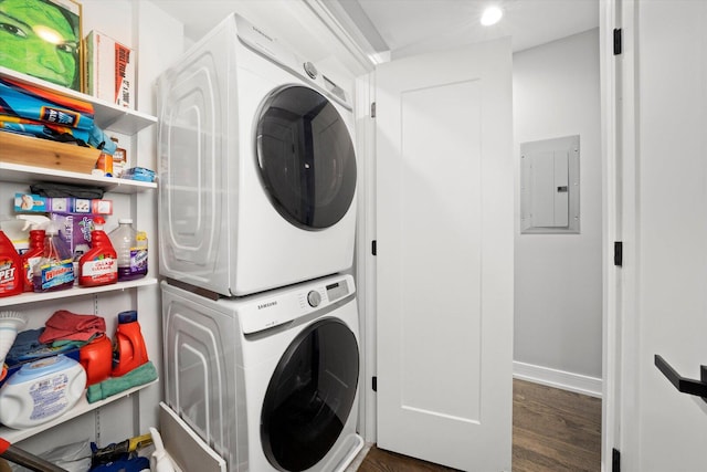 7230 W Belden Ave Unit 1, Elmwood Park, IL 60707 - laundry area with estacked washer and dryer, electric panel, wood finished floors, and baseboards