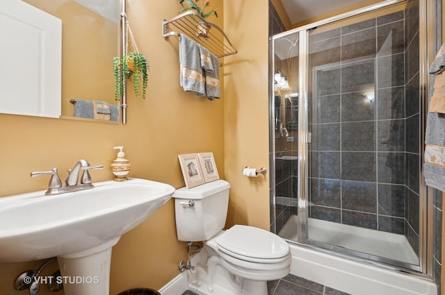 1530 S State St Unit 408, Chicago, IL 60605 - bathroom with toilet, a stall shower, tile patterned floors, and a sink