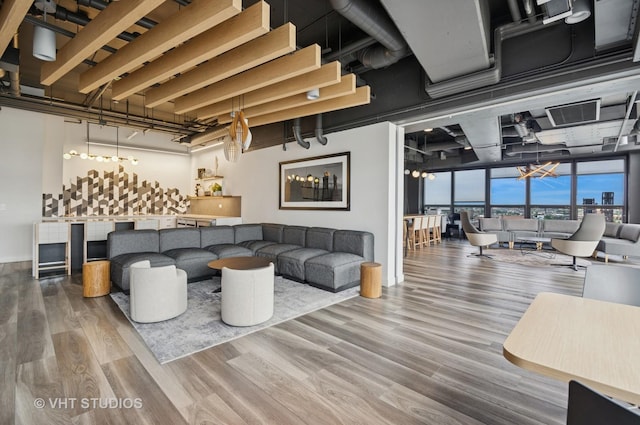 1530 S State St Unit 408, Chicago, IL 60605 - living area featuring wood finished floors and a chandelier