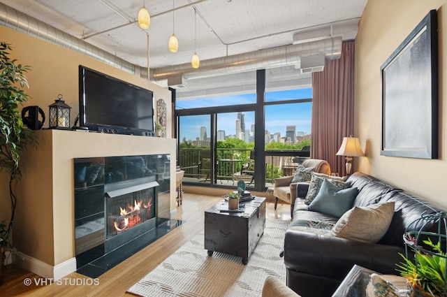 1530 S State St Unit 408, Chicago, IL 60605 - living area with wood finished floors, a premium fireplace, and a wall of windows