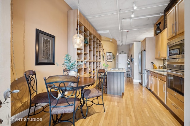 1530 S State St Unit 408, Chicago, IL 60605 - dining room featuring attic access, light wood-style flooring, baseboards, and track lighting