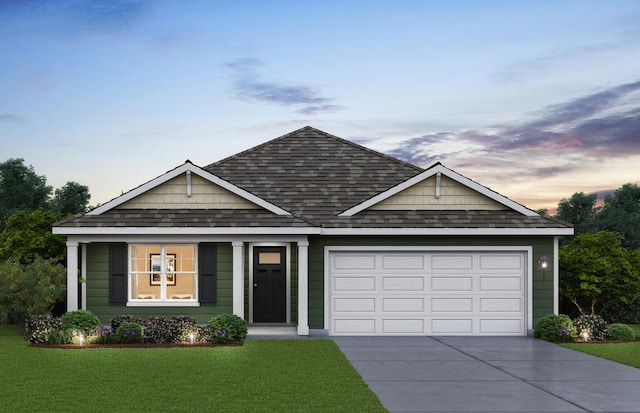 2276 Elderberry Ct, Wonder Lake, IL 60097 - view of front of home featuring concrete driveway, a shingled roof, a yard, and a garage