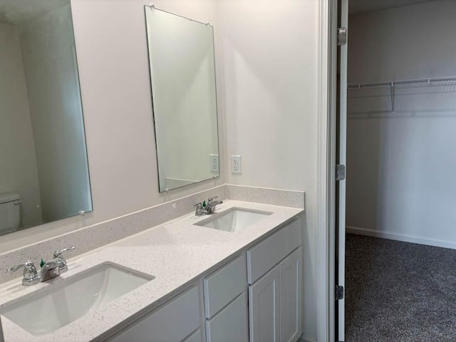 2276 Elderberry Ct, Wonder Lake, IL 60097 - bathroom with toilet, double vanity, and a spacious closet