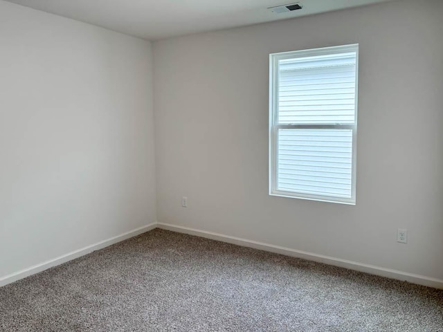 2276 Elderberry Ct, Wonder Lake, IL 60097 - carpeted empty room featuring baseboards and healthy amount of natural light