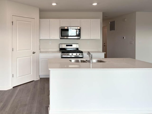 2276 Elderberry Ct, Wonder Lake, IL 60097 - kitchen featuring stainless steel appliances, a sink, dark wood-type flooring, white cabinets, and recessed lighting