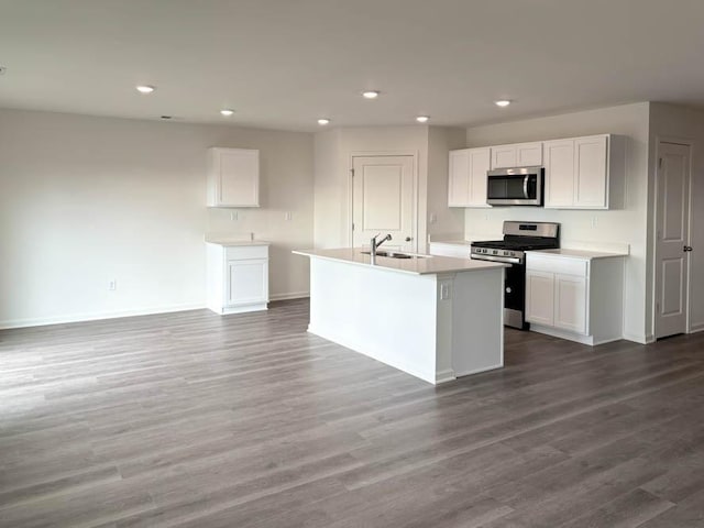 2276 Elderberry Ct, Wonder Lake, IL 60097 - kitchen featuring appliances with stainless steel finishes, a sink, baseboards, recessed lighting, and white cabinets