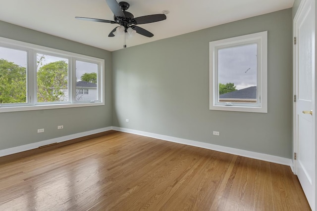415 Honey Locust Ln, Willowbrook, IL 60527 - unfurnished room with baseboards, wood finished floors, and a ceiling fan