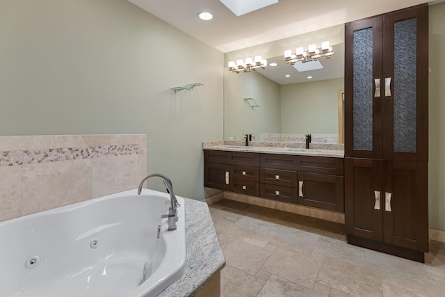 415 Honey Locust Ln, Willowbrook, IL 60527 - bathroom featuring a skylight, double vanity, a tub with jets, and baseboards