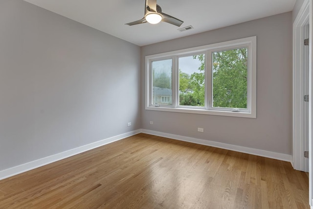 415 Honey Locust Ln, Willowbrook, IL 60527 - empty room featuring baseboards, light wood-style floors, and ceiling fan