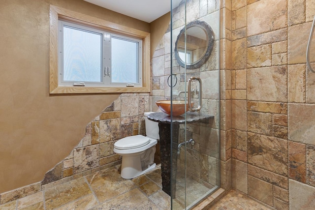 415 Honey Locust Ln, Willowbrook, IL 60527 - bathroom with stone tile flooring, a shower stall, toilet, and a sink
