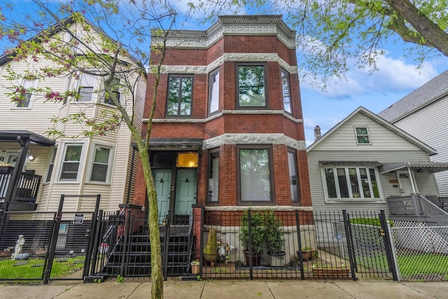 4419 S Wallace St, Chicago, IL 60609 - view of front facade with brick siding, a gate, and a fenced front yard