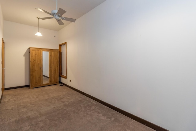 4419 S Wallace St, Chicago, IL 60609 - unfurnished room with light colored carpet, ceiling fan, baseboards, and a high ceiling