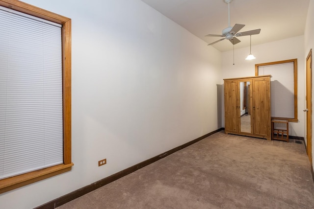 4419 S Wallace St, Chicago, IL 60609 - spare room featuring light colored carpet, ceiling fan, baseboards, and high vaulted ceiling