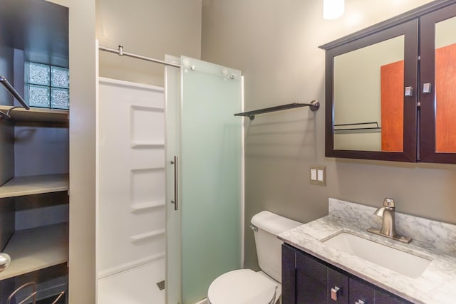 4419 S Wallace St, Chicago, IL 60609 - bathroom with a shower stall, vanity, and toilet