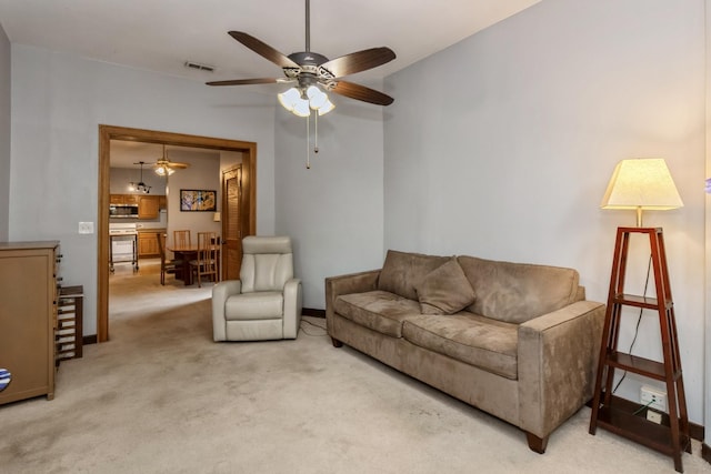 4419 S Wallace St, Chicago, IL 60609 - living room with ceiling fan, light colored carpet, and baseboards