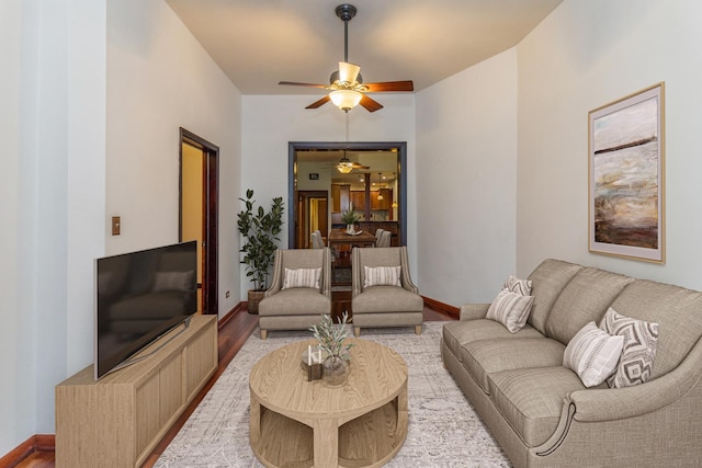 4419 S Wallace St, Chicago, IL 60609 - living area with a ceiling fan, light wood-style floors, and baseboards