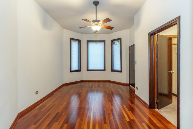 4419 S Wallace St, Chicago, IL 60609 - unfurnished room with hardwood / wood-style floors, a ceiling fan, and baseboards