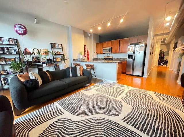 2323 W Pershing Rd Unit 421, Chicago, IL 60609 - living room featuring track lighting and light wood finished floors