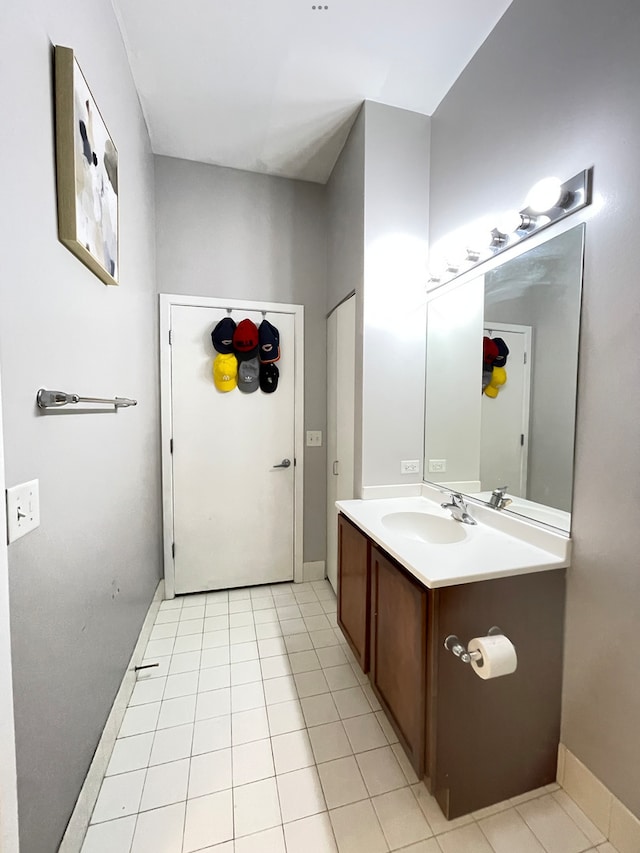2323 W Pershing Rd Unit 421, Chicago, IL 60609 - bathroom featuring vanity, tile patterned flooring, and baseboards