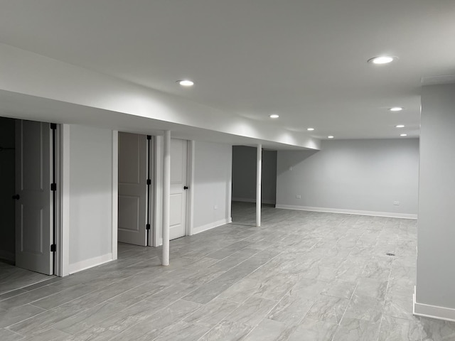 finished below grade area with recessed lighting and baseboards
