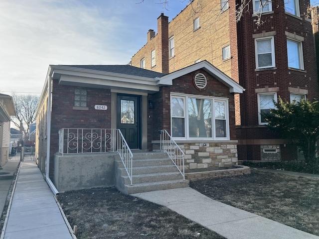 view of front of home with brick siding