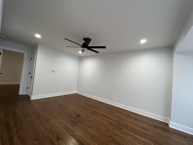 empty room with baseboards, ceiling fan, recessed lighting, and dark wood-type flooring