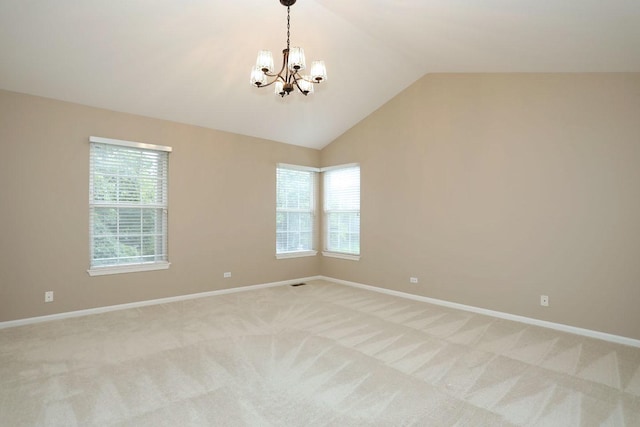 1437 Sturgeon Bay Ct, Schaumburg, IL 60173 - spare room featuring a chandelier, light carpet, plenty of natural light, and vaulted ceiling
