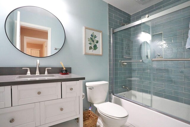 1437 Sturgeon Bay Ct, Schaumburg, IL 60173 - bathroom featuring vanity, bath / shower combo with glass door, and toilet