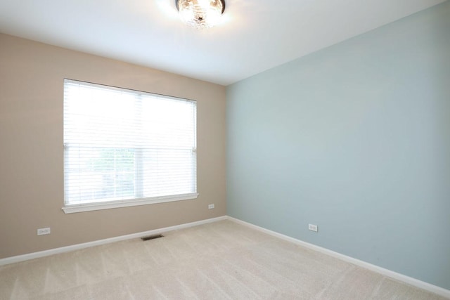 1437 Sturgeon Bay Ct, Schaumburg, IL 60173 - unfurnished room featuring baseboards and light colored carpet