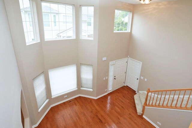 1437 Sturgeon Bay Ct, Schaumburg, IL 60173 - foyer entrance with wood finished floors, baseboards, and a high ceiling