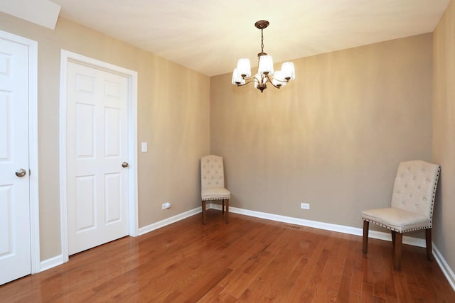 1437 Sturgeon Bay Ct, Schaumburg, IL 60173 - unfurnished room with a chandelier, wood finished floors, and baseboards