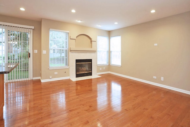 1437 Sturgeon Bay Ct, Schaumburg, IL 60173 - unfurnished living room with light wood-type flooring, baseboards, healthy amount of natural light, and recessed lighting