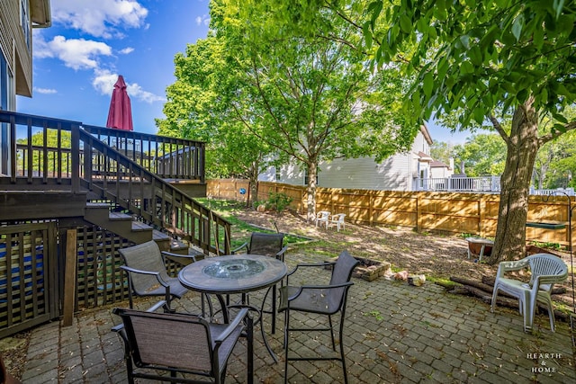 1101 Paul Ct, Fox River Grove, IL 60021 - fenced backyard featuring a patio area, stairs, outdoor dining space, and a deck