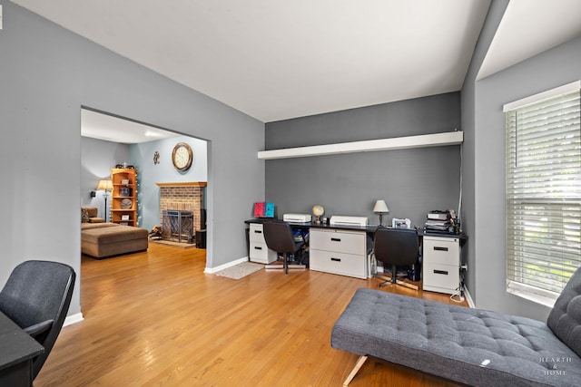 1101 Paul Ct, Fox River Grove, IL 60021 - office area featuring a fireplace, wood finished floors, plenty of natural light, and baseboards