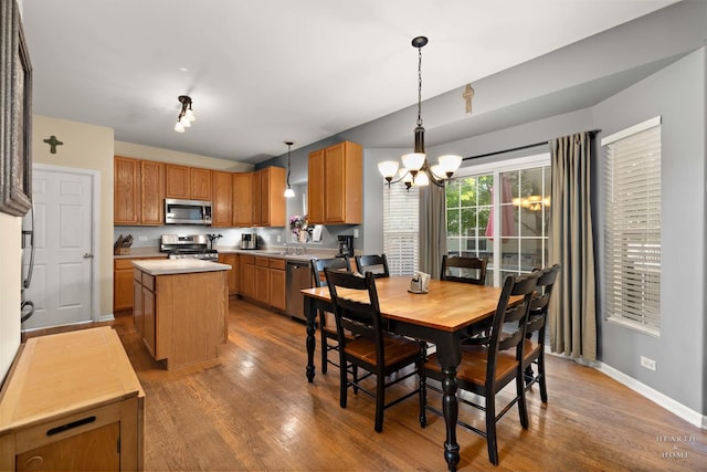 1101 Paul Ct, Fox River Grove, IL 60021 - dining room featuring a chandelier, wood finished floors, and baseboards
