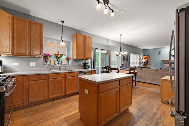 1101 Paul Ct, Fox River Grove, IL 60021 - kitchen with a sink, stainless steel appliances, open floor plan, and light wood-style flooring