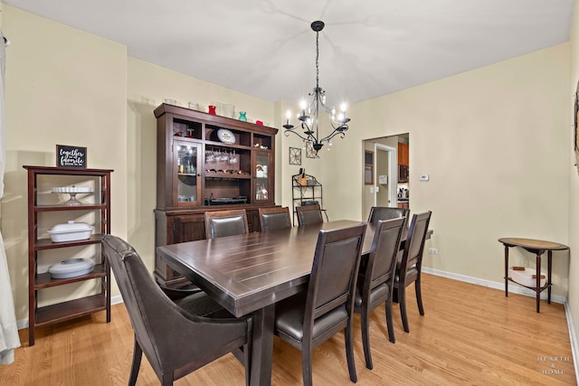 1101 Paul Ct, Fox River Grove, IL 60021 - dining space with a chandelier, light wood-style flooring, and baseboards