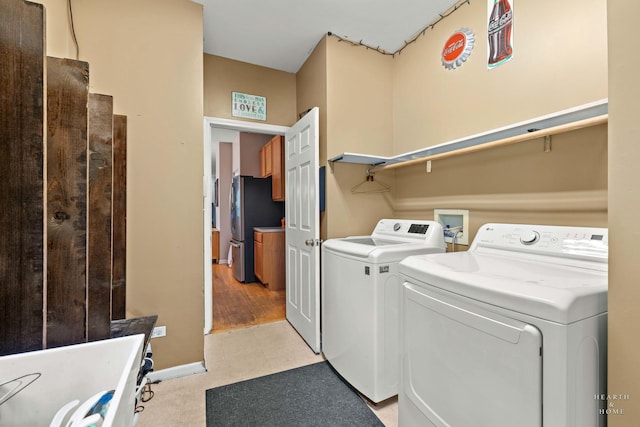 1101 Paul Ct, Fox River Grove, IL 60021 - laundry room featuring washing machine and dryer, light flooring, and baseboards