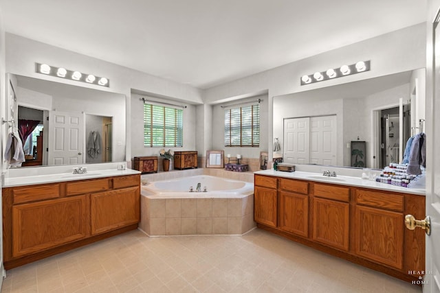 1101 Paul Ct, Fox River Grove, IL 60021 - full bathroom featuring a garden tub, tile patterned flooring, two vanities, and a shower stall
