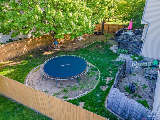1101 Paul Ct, Fox River Grove, IL 60021 - view of yard featuring a wooden deck and a trampoline