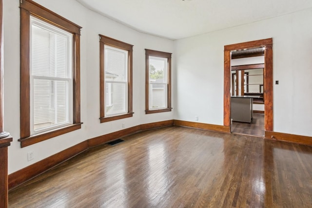 1006 W 1st St, Dixon, IL 61021 - unfurnished room with wood finished floors and baseboards