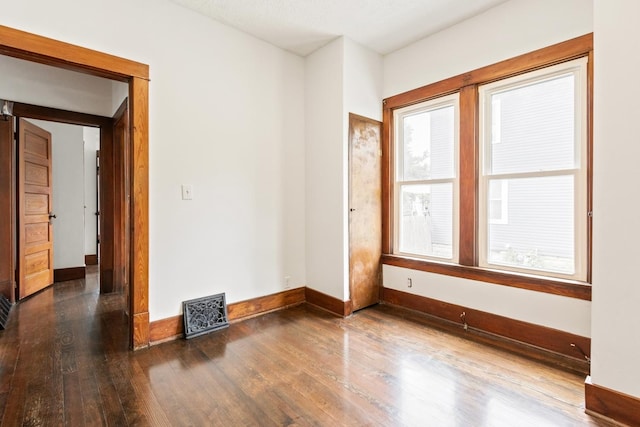 1006 W 1st St, Dixon, IL 61021 - unfurnished room featuring wood finished floors and baseboards