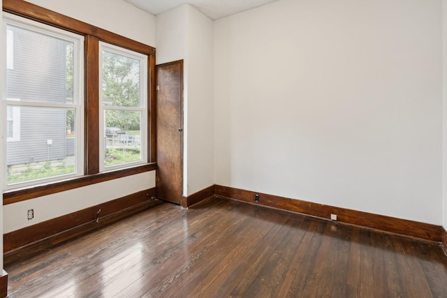 1006 W 1st St, Dixon, IL 61021 - spare room with baseboards and hardwood / wood-style floors