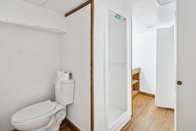 1006 W 1st St, Dixon, IL 61021 - bathroom with toilet, wood finished floors, and a stall shower