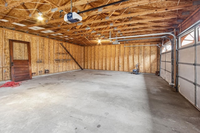 1006 W 1st St, Dixon, IL 61021 - garage featuring a garage door opener