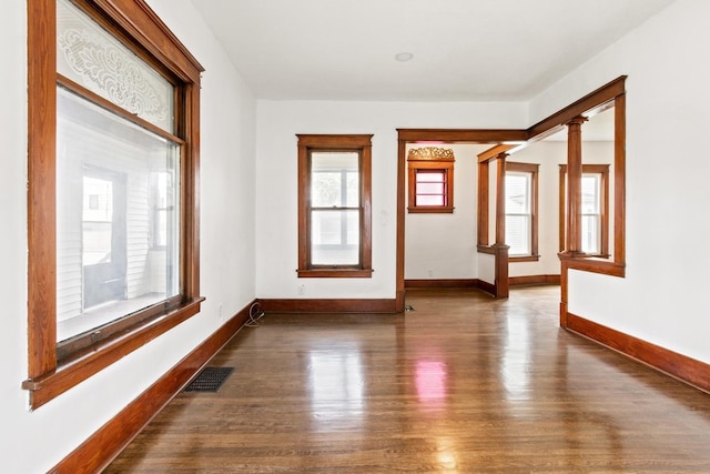 1006 W 1st St, Dixon, IL 61021 - spare room featuring wood finished floors and baseboards