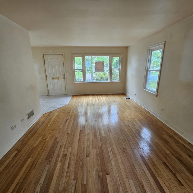 237 Pine St, Villa Park, IL 60181 - unfurnished living room with light wood-type flooring and baseboards