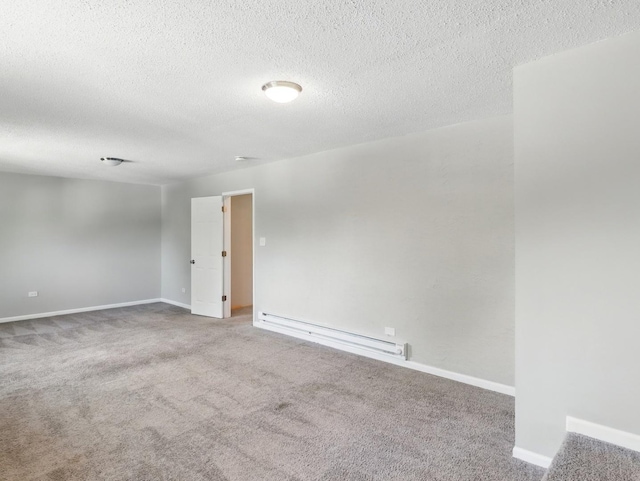 17704 Grandview Dr, Hazel Crest, IL 60429 - carpeted empty room featuring baseboard heating, baseboards, and a textured ceiling