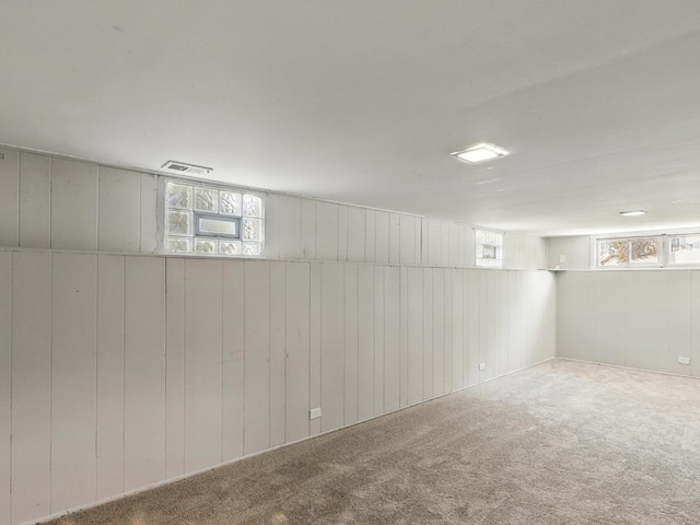 17704 Grandview Dr, Hazel Crest, IL 60429 - basement with healthy amount of natural light, carpet flooring, and wooden walls